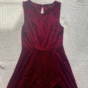 Small, lacy, wine-colored, knee length dress!